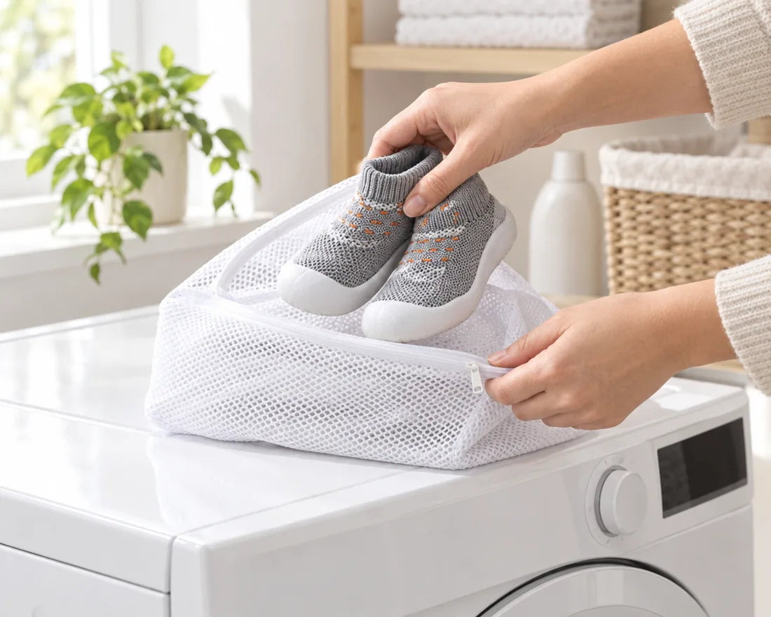 Sock shoes going into a mesh wash bag on top of a washing machine